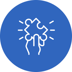 Hand holding puzzle piece, blue background.